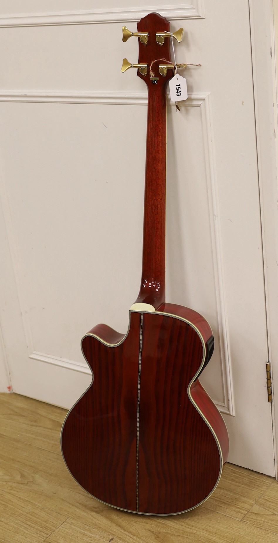 A Crafter electro-acoustic bass guitar. Model No. BA-600EQ/AMS-P Serial No. 00202718, 113cms high.